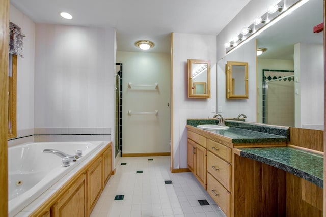 bathroom featuring vanity, independent shower and bath, and tile patterned flooring