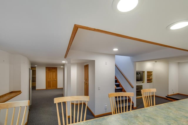 dining area with dark carpet