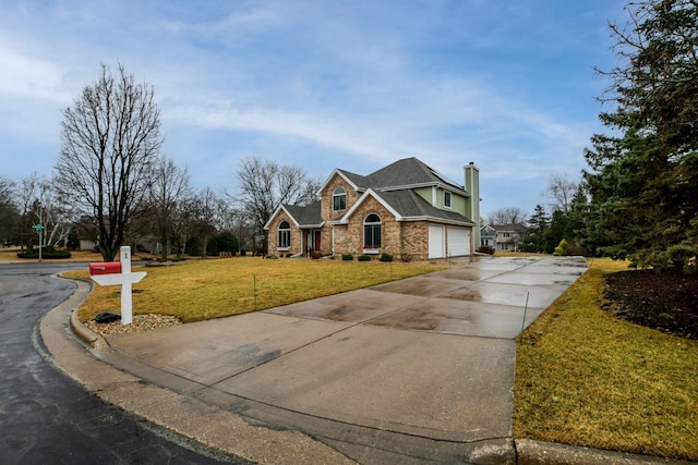 view of front of home with a garage and a front lawn