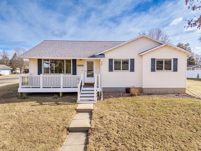 view of front of property with a front yard and covered porch