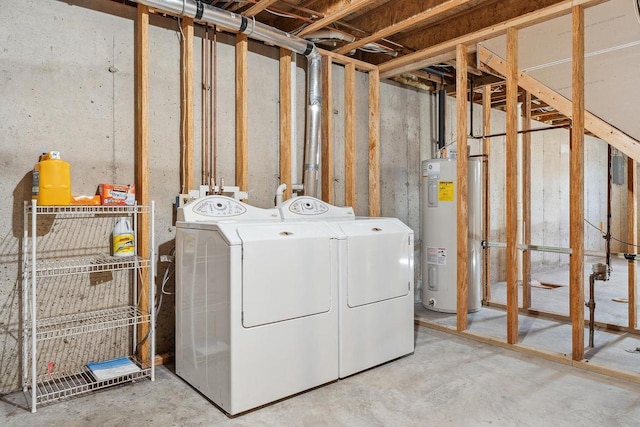 laundry area featuring washing machine and dryer and electric water heater