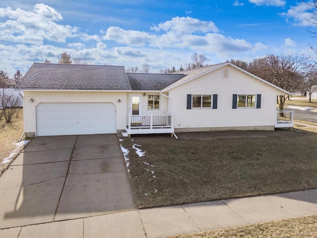 ranch-style house with a garage and a front yard