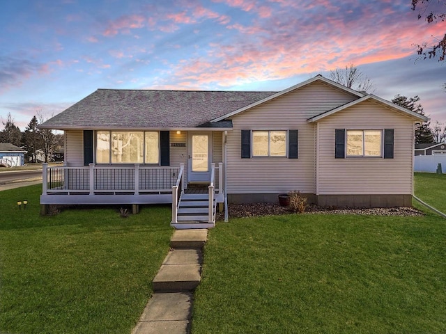 view of front of home with a yard