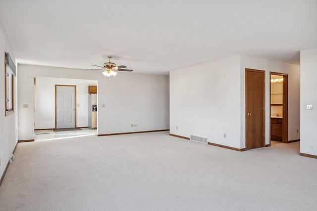 carpeted empty room with ceiling fan