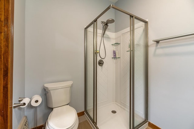 bathroom with walk in shower and toilet