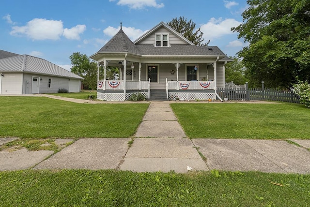 view of front of property with covered porch and a front yard