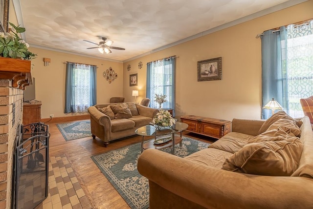 living room featuring ceiling fan, crown molding, plenty of natural light, and wood-type flooring