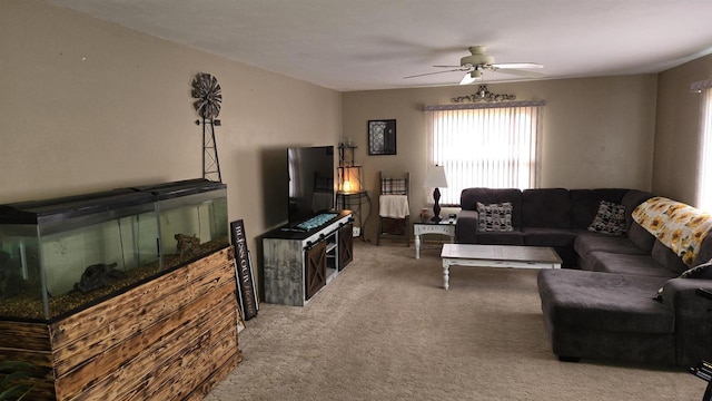 carpeted living room with ceiling fan