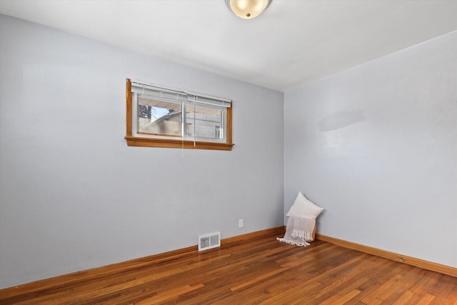 empty room featuring dark hardwood / wood-style flooring