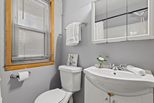 bathroom featuring sink and toilet