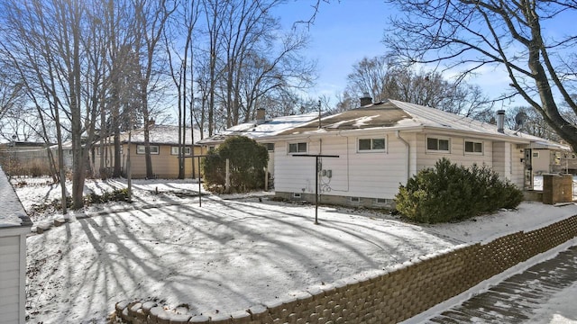 view of snow covered property