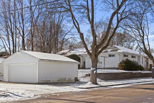 view of front of house featuring a garage and an outdoor structure