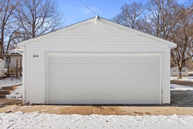 view of snow covered garage