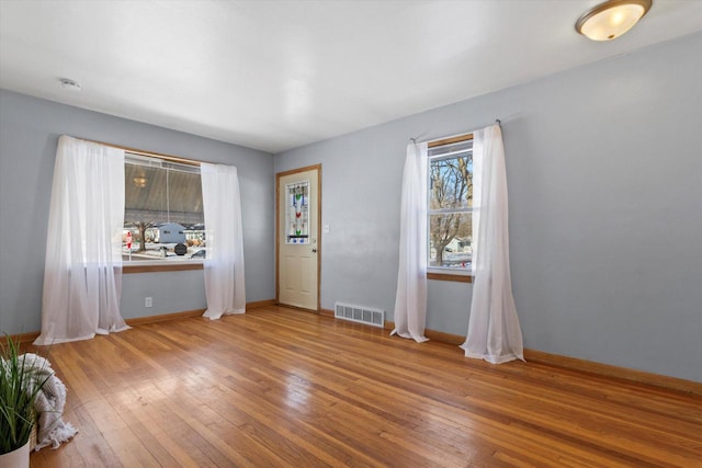 unfurnished room featuring wood-type flooring