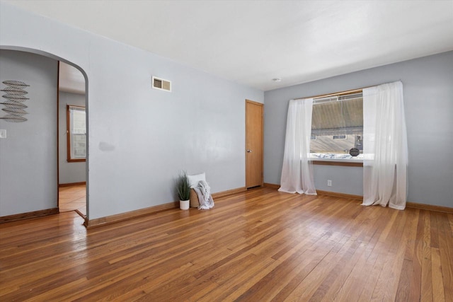 spare room featuring hardwood / wood-style flooring