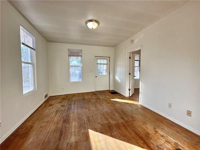 foyer entrance with wood-type flooring