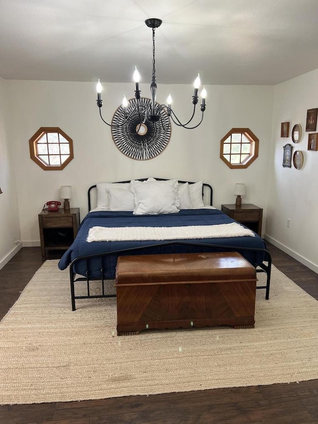 bedroom with dark wood-type flooring