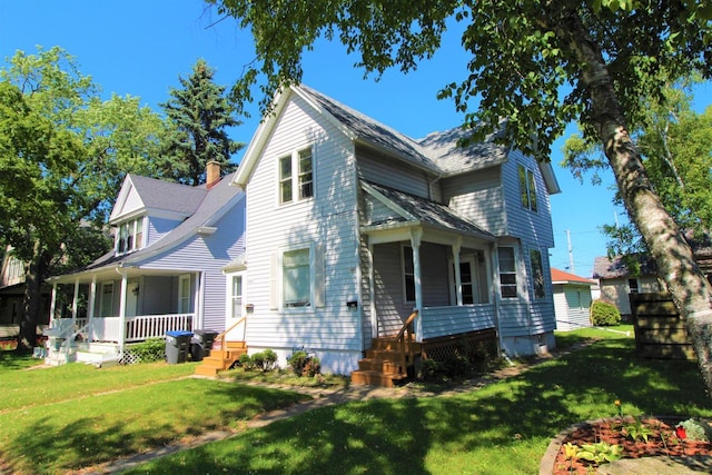 exterior space with a porch and a front yard