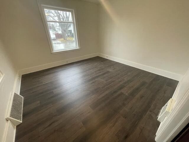 bonus room with dark wood-type flooring