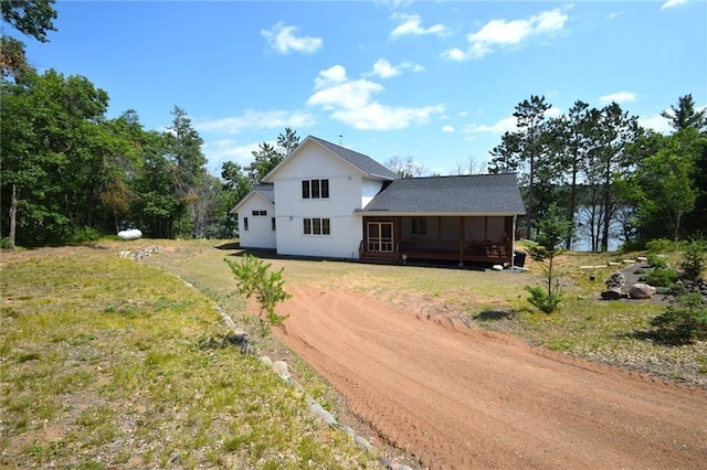 view of front of home featuring a front yard and covered porch