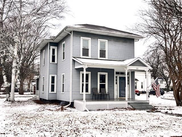 view of property with covered porch