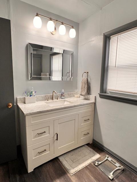 bathroom with vanity and hardwood / wood-style floors