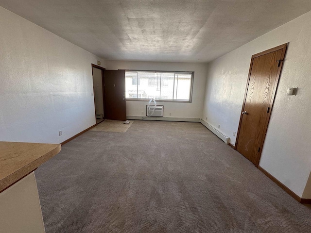 unfurnished room with light carpet, a baseboard radiator, and a wall mounted AC