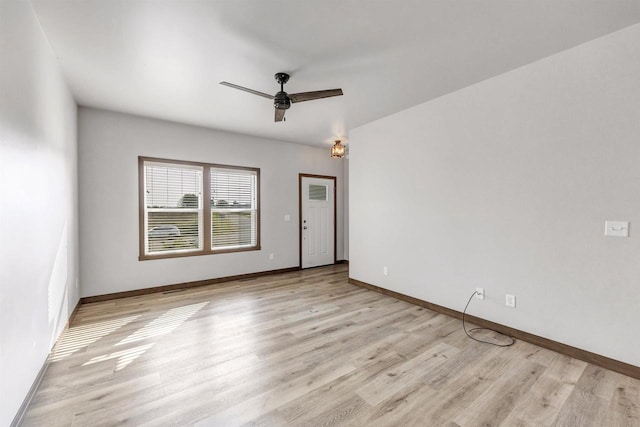 unfurnished room featuring ceiling fan and light wood-type flooring