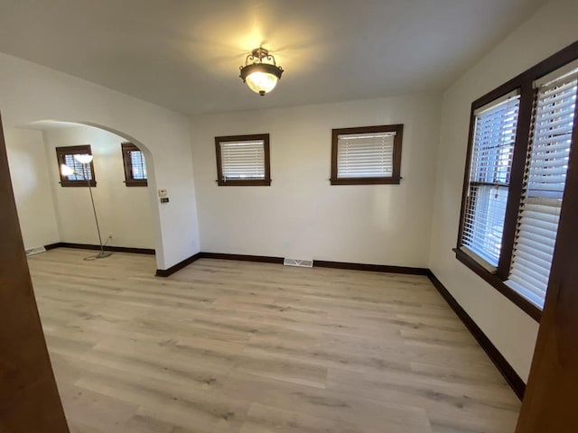 spare room with light wood-type flooring