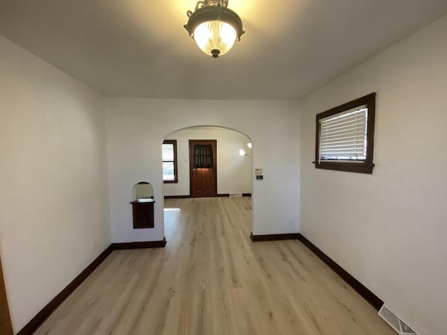 hall with light hardwood / wood-style floors