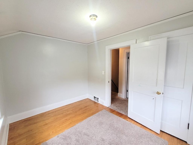 unfurnished room featuring wood-type flooring