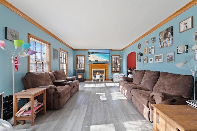 living room featuring crown molding and light hardwood / wood-style floors