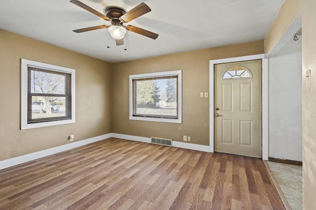 entryway with ceiling fan and light wood-type flooring