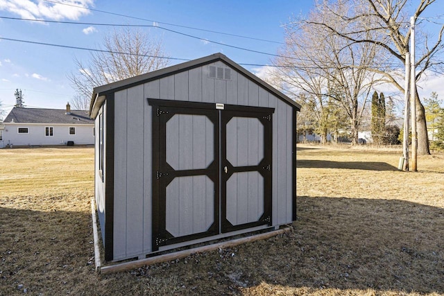 view of outdoor structure with a yard