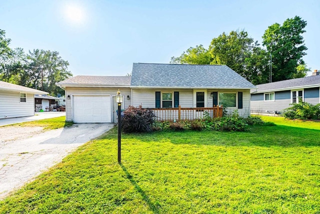 ranch-style house featuring a garage and a front yard