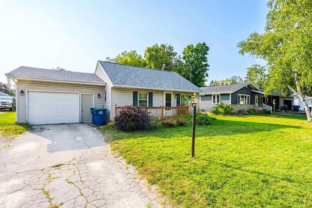 ranch-style home with a garage, a porch, and a front yard