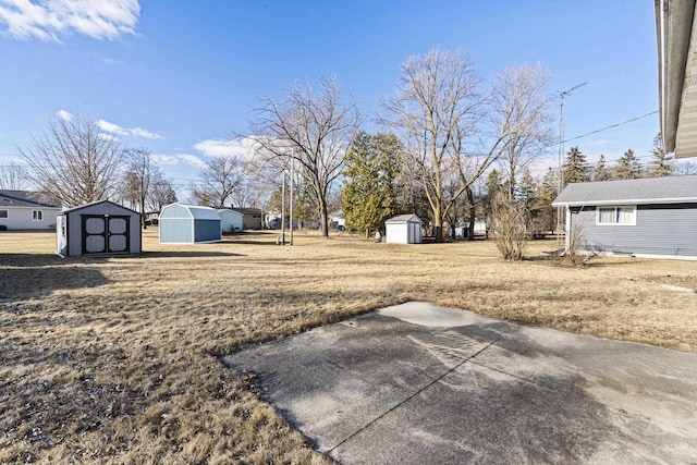 view of yard featuring a patio area and a storage unit