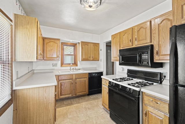 kitchen featuring sink and black appliances