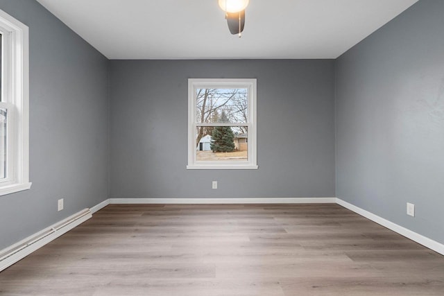 spare room with light hardwood / wood-style flooring