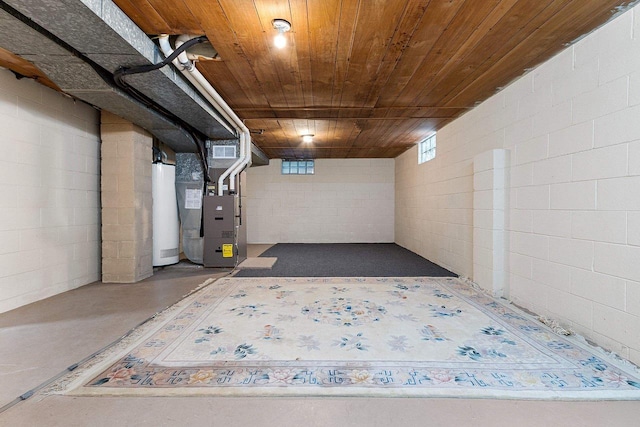 basement with gas water heater, heating unit, and wood ceiling