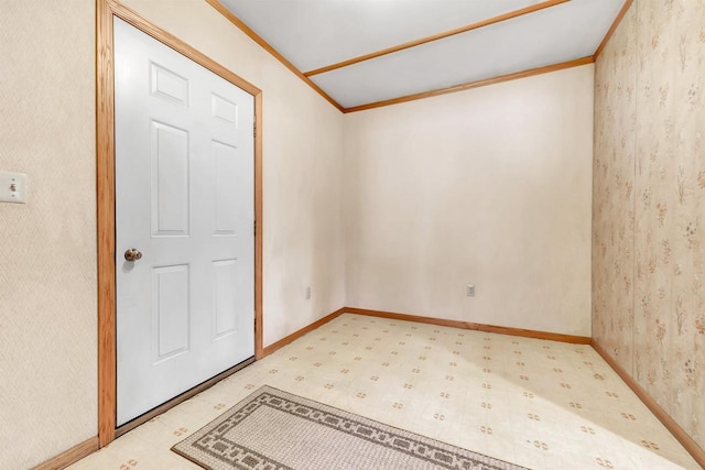 empty room featuring ornamental molding