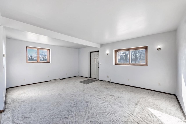 empty room featuring light colored carpet