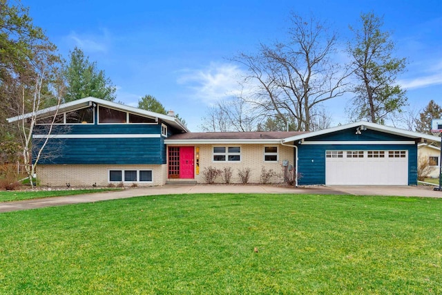 view of front of house with a front yard and a garage