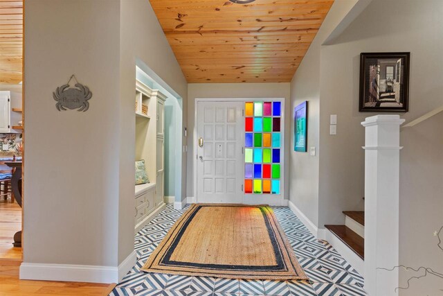865 Richmond Way, Nekoosa, WI 54457 - entryway featuring baseboards, wood ceiling, and stairway