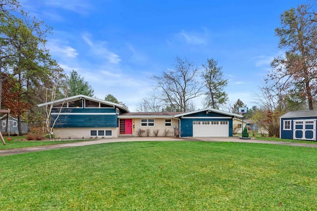 865 Richmond Way, Nekoosa, WI 54457 - split level home featuring concrete driveway, a garage, a front lawn, and a storage shed