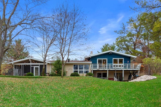 865 Richmond Way, Nekoosa, WI 54457 - back of property featuring brick siding, a sunroom, a lawn, and a wooden deck