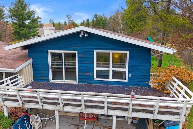 865 Richmond Way, Nekoosa, WI 54457 - view of side of home featuring a chimney and a deck