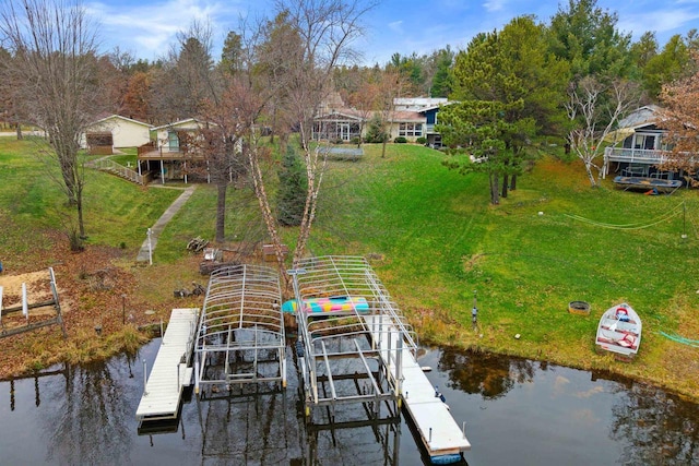 865 Richmond Way, Nekoosa, WI 54457 - dock area featuring boat lift, a water view, and a lawn