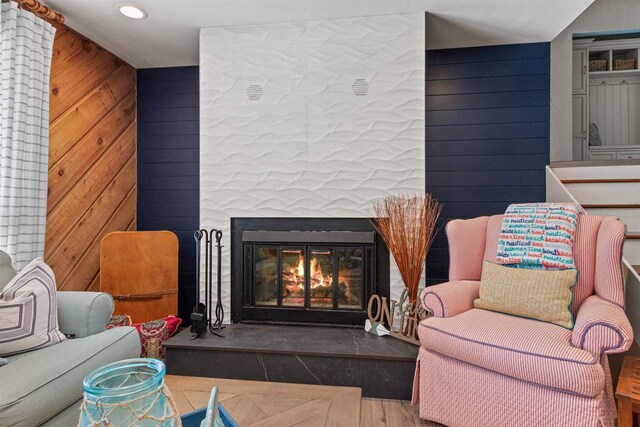 865 Richmond Way, Nekoosa, WI 54457 - living area with a glass covered fireplace, wood finished floors, recessed lighting, and wooden walls