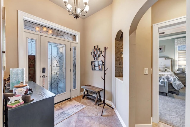 foyer featuring a notable chandelier